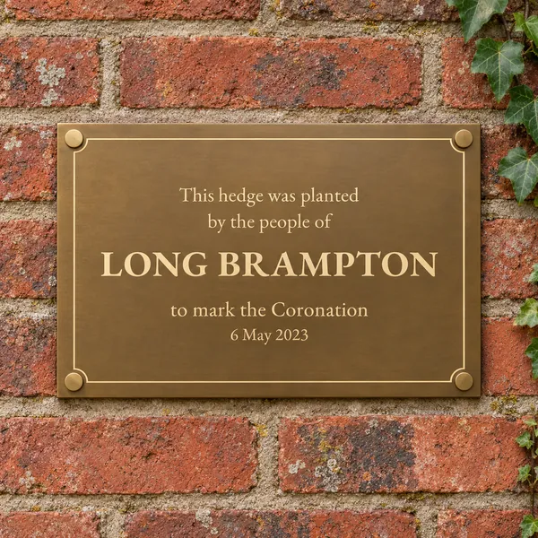 Personalised aged brass plaque 297 × 210 mm, shown with example wording