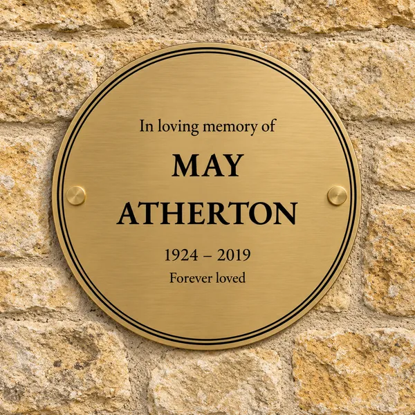 Personalised brushed brass circular plaque 200 × 200 mm, shown with example wording