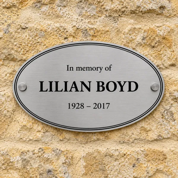 Personalised brushed stainless steel oval plaque 250 × 150 mm, shown with example wording