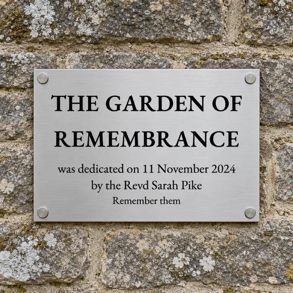 Personalised brushed stainless steel plaque 297 × 210 mm, shown with example wording