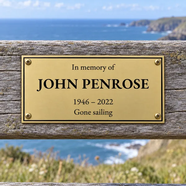 Personalised orbital brass bench plaque 150 × 75 mm, shown with example wording
