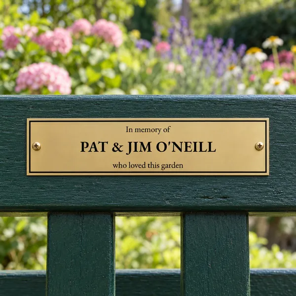 Personalised orbital brass bench plaque 200 × 50 mm, shown with example wording