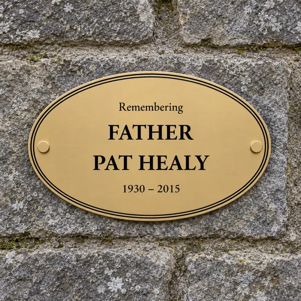 Personalised orbital brass oval plaque 250 × 150 mm, shown with example wording