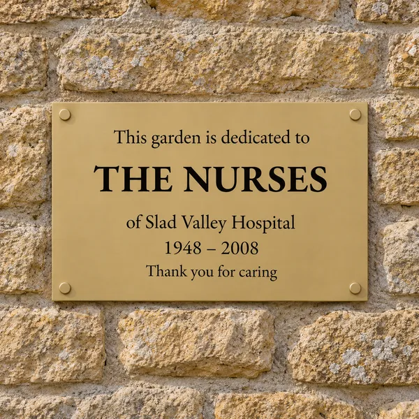 Personalised orbital brass plaque 300 × 200 mm, shown with example wording