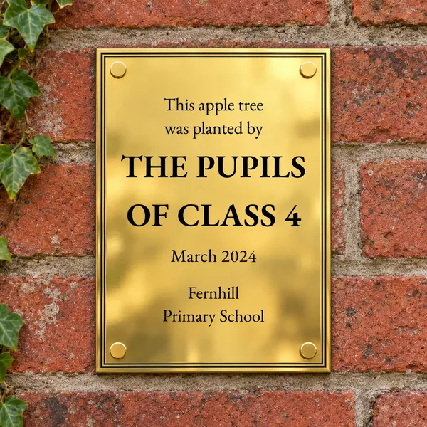 Personalised polished brass plaque 148 × 210 mm, shown with example wording