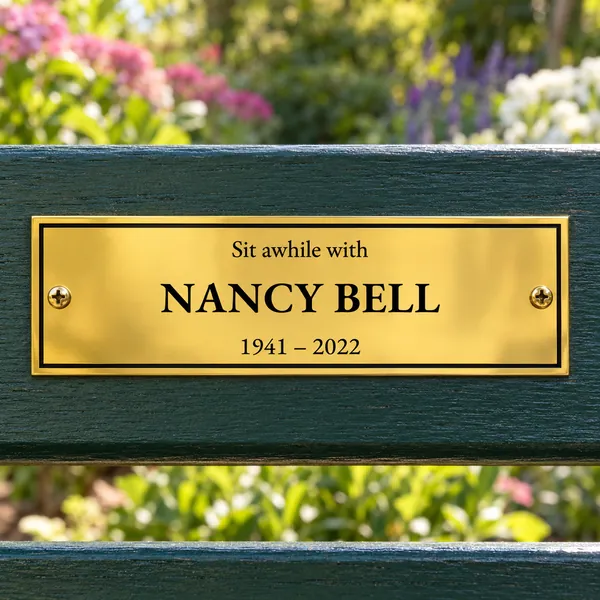 Personalised polished brass bench plaque 150 × 50 mm, shown with example wording