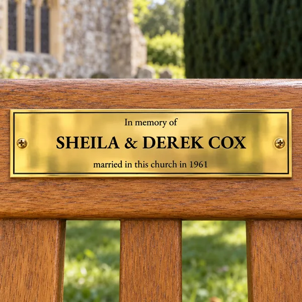 Personalised polished brass bench plaque 200 × 50 mm, shown with example wording