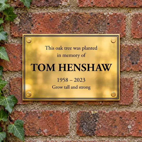 Personalised polished brass plaque 210 × 148 mm, shown with example wording