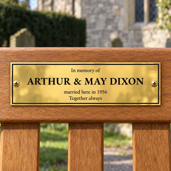 Personalised polished brass bench plaque 225 × 75 mm, shown with example wording