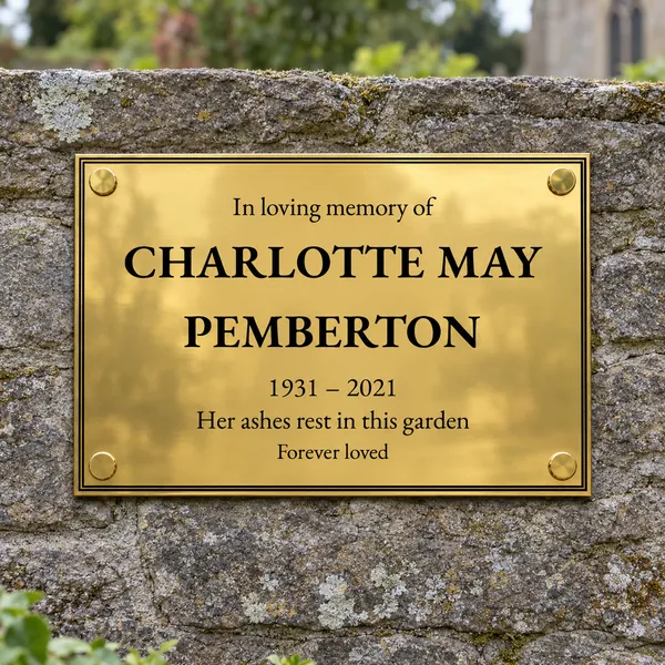 Personalised polished brass plaque 297 × 210 mm, shown with example wording
