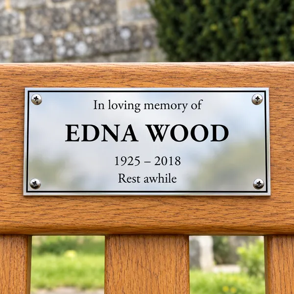 Personalised polished stainless steel bench plaque 150 × 75 mm, shown with example wording