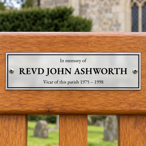 Personalised polished stainless steel bench plaque 225 × 65 mm, shown with example wording