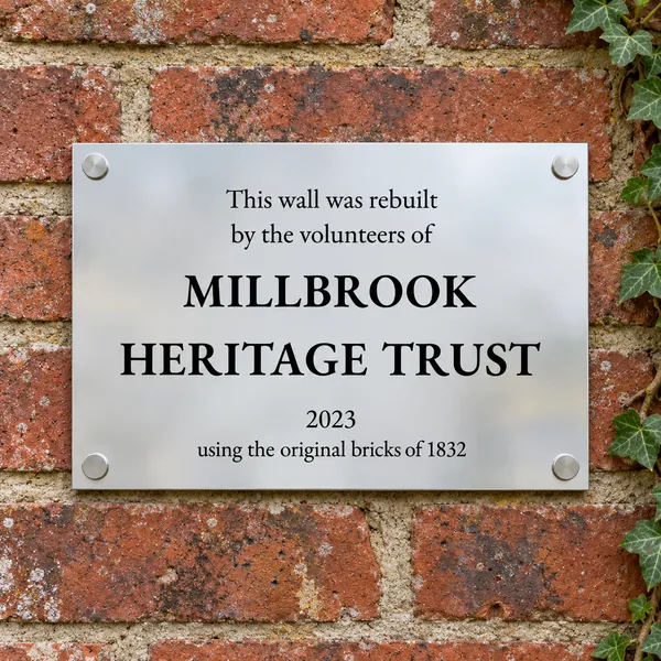 Personalised polished stainless steel plaque 297 × 210 mm, shown with example wording