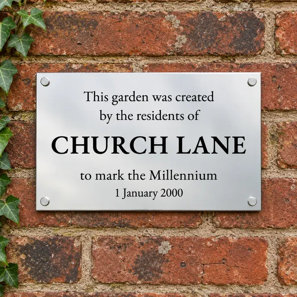 Personalised polished stainless steel plaque 300 × 200 mm, shown with example wording